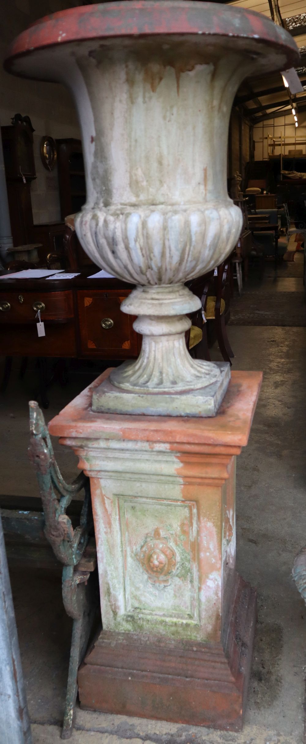 A Victorian terracotta campana garden urn on pedestal, urn 60cm diameter, total height 166cm